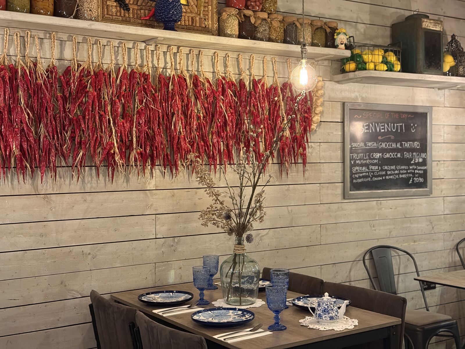 Dining room with chilli garlands and majolica plates